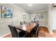 Elegant dining room with a large wooden table and seating for six, perfect for Gathering meals at 1326 Mcpherson Ave., Atlanta, GA 30316