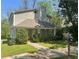 Two-story house with a gabled roof, a chimney, green bushes, and a sidewalk at 1326 Mcpherson Ave., Atlanta, GA 30316
