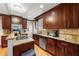 Well-equipped kitchen with ample cabinet space, granite counters, stainless steel appliances, and hardwood floors at 1326 Mcpherson Ave., Atlanta, GA 30316