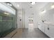 Modern bathroom features a glass walk-in shower, double vanity, and sleek fixtures at 1375 Harris Rd, Lawrenceville, GA 30043