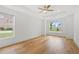 Airy bedroom with two bright windows, tray ceiling, and hardwood flooring at 1375 Harris Rd, Lawrenceville, GA 30043