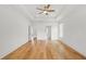 Spacious primary bedroom featuring tray ceilings and hardwood floors at 1375 Harris Rd, Lawrenceville, GA 30043