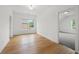 Bright bedroom with hardwood floors, a large window and neutral walls at 1375 Harris Rd, Lawrenceville, GA 30043