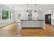 Gourmet kitchen featuring a large island, stainless steel appliances, and an open layout at 1375 Harris Rd, Lawrenceville, GA 30043