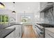 Bright, spacious kitchen with a farmhouse sink, stone countertops, and stainless steel oven at 1375 Harris Rd, Lawrenceville, GA 30043