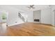 Spacious living area showcases hardwood floors, minimalist fireplace, and access to staircase at 1375 Harris Rd, Lawrenceville, GA 30043