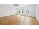 Spacious living room with hardwood floors and plenty of natural light from the many windows at 1375 Harris Rd, Lawrenceville, GA 30043