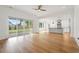 Open-concept living space with hardwood floors, a kitchen, and sliding doors to the backyard at 1375 Harris Rd, Lawrenceville, GA 30043
