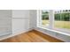Spacious walk-in closet with built in shelves and a large window at 1375 Harris Rd, Lawrenceville, GA 30043