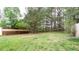 Large backyard with trees and a partial fence at 1941 Patterson Park Dr, Lawrenceville, GA 30044