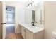 Bright bathroom featuring modern lighting, white cabinets, and a stylish quartz countertop at 1941 Patterson Park Dr, Lawrenceville, GA 30044