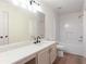 This bathroom features wood-look floors, a tub, and a white double sink vanity at 1941 Patterson Park Dr, Lawrenceville, GA 30044
