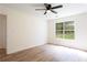 Bright bedroom with hardwood floors, a large window, and ample natural light creating a cozy atmosphere at 1941 Patterson Park Dr, Lawrenceville, GA 30044