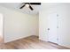 Neutral bedroom with ceiling fan and wood-look flooring at 1941 Patterson Park Dr, Lawrenceville, GA 30044