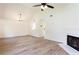 Spacious living room with hardwood floors, fireplace, and open view to kitchen at 1941 Patterson Park Dr, Lawrenceville, GA 30044