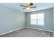 Bedroom with a ceiling fan and carpeted floors at 2384 Coach Way, Jonesboro, GA 30236