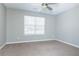Bedroom with a ceiling fan and carpeted floors at 2384 Coach Way, Jonesboro, GA 30236