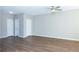 Spacious bedroom features wood floors, neutral walls, ceiling fan, and two closets at 2384 Coach Way, Jonesboro, GA 30236