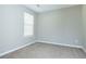 Bedroom with a window and carpeted floors at 2384 Coach Way, Jonesboro, GA 30236