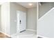 Inviting entryway features tile flooring, a neutral color palette, and access to the upper level at 2384 Coach Way, Jonesboro, GA 30236