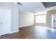 This expansive living room features wood floors and plenty of natural light at 2384 Coach Way, Jonesboro, GA 30236