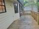 The wood deck shows a space to enjoy with a view of the backyard, near a window, exterior door, and guest home at 4148 Silver Hill Ct, Snellville, GA 30039