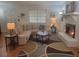 Cozy living room with a fireplace, comfortable seating, and stylish decor at 4148 Silver Hill Ct, Snellville, GA 30039