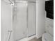 Bathroom featuring a glass enclosed shower with chrome trim and fixtures at 3824 Vineyards Lake Nw Cir # U16, Kennesaw, GA 30144