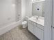 Clean bathroom with a tub/shower combo, and a white vanity at 3824 Vineyards Lake Nw Cir # U16, Kennesaw, GA 30144