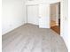 Bright bedroom with plush carpeting and a closet with double doors at 3824 Vineyards Lake Nw Cir # U16, Kennesaw, GA 30144