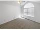 Empty bedroom with vaulted ceilings, a large window, and neutral carpet at 3824 Vineyards Lake Nw Cir # U16, Kennesaw, GA 30144