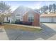 Charming single-story home featuring a brick facade and well-maintained landscaping at 3824 Vineyards Lake Nw Cir # U16, Kennesaw, GA 30144