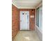 Exterior view of front door with red brick and sidelight window at 3824 Vineyards Lake Nw Cir # U16, Kennesaw, GA 30144