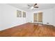 Hardwood floored bedroom featuring neutral walls, double doors, and modern ceiling fan at 2341 Cedar Dr, Lawrenceville, GA 30043