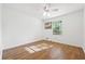 Clean bedroom featuring light-colored walls, wood-look floors, and a ceiling fan with light at 2341 Cedar Dr, Lawrenceville, GA 30043