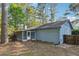 Charming home featuring a cozy screened-in porch and a spacious backyard, ideal for outdoor living and entertaining at 2341 Cedar Dr, Lawrenceville, GA 30043