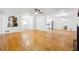 Spacious living room with hardwood floors, open layout, and a view into the kitchen at 2341 Cedar Dr, Lawrenceville, GA 30043