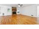 Bright living room features a stone fireplace and gleaming hardwood floors at 2341 Cedar Dr, Lawrenceville, GA 30043
