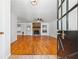 View of the living room with hardwood floors and a stone fireplace as seen from the front door at 2341 Cedar Dr, Lawrenceville, GA 30043