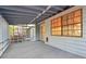 Enclosed porch with serene views, featuring light blue accents and ample space for relaxing and entertaining guests at 2341 Cedar Dr, Lawrenceville, GA 30043