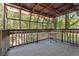 Enclosed porch with rustic wood frame, offering a unique outdoor space to enjoy nature and the surrounding scenery at 2341 Cedar Dr, Lawrenceville, GA 30043