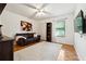Cozy bedroom with plush rug, ceiling fan, comfortable seating, and natural light at 3730 Willow Mill Dr, Lawrenceville, GA 30044