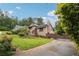 Charming two-story home with well-maintained landscaping, long driveway, and inviting entrance at 3730 Willow Mill Dr, Lawrenceville, GA 30044