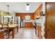 Traditional kitchen with stainless steel appliances, wood cabinets, tile flooring, and eat in dining at 3730 Willow Mill Dr, Lawrenceville, GA 30044