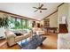 Spacious living room with vaulted ceilings, hardwood floors, and large windows providing natural light at 3730 Willow Mill Dr, Lawrenceville, GA 30044