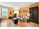 Bright living room featuring a sofa, chair, and shelves against yellow walls with parquet floors at 3730 Willow Mill Dr, Lawrenceville, GA 30044