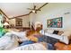 Comfortable living room with stone table, unique art, vaulted ceiling, and hardwood floors at 3730 Willow Mill Dr, Lawrenceville, GA 30044