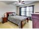 A bedroom featuring soft natural lighting, traditional furniture, and a wooden bedframe at 6990 Annie Walk, Lithonia, GA 30038