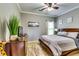 Relax in a comfortable bedroom featuring soft lighting and plush carpets at 6990 Annie Walk, Lithonia, GA 30038