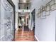 Inviting foyer with rich hardwood floors, wrought iron banister, and soaring ceilings creating a grand entrance at 6990 Annie Walk, Lithonia, GA 30038